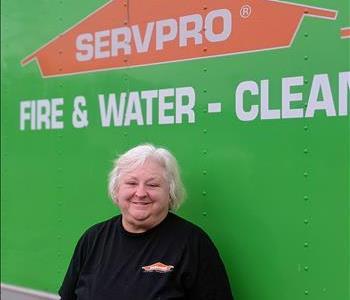 Bobbie standing in front of SERVPRO vehicle