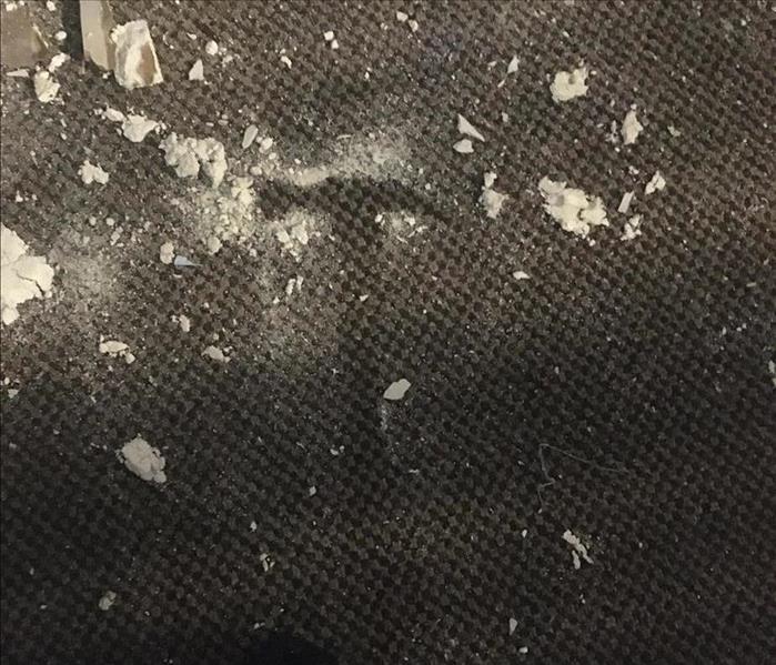 Imprint of hammer on wet/dirty carpet