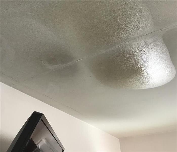 Frozen water puddle on ceiling
